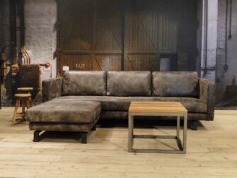 grijze geschuurd leren bank