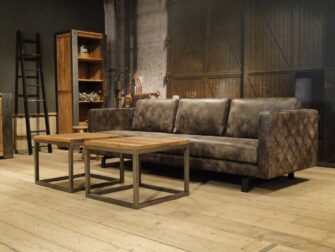 grijze geschuurd leren bank