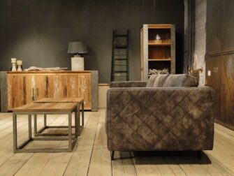 grijze geschuurd leren bank